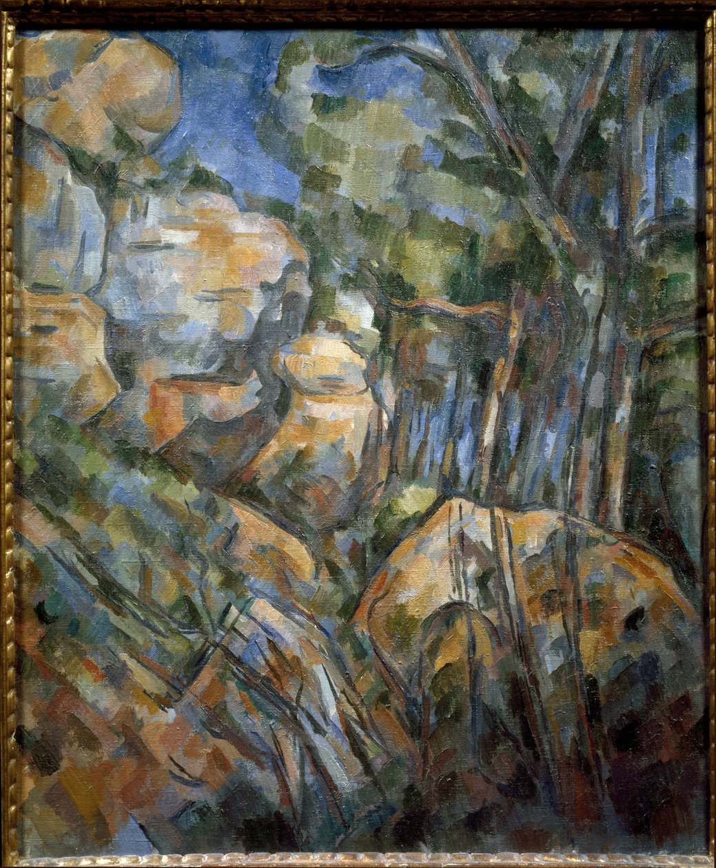 Klipper nær hulerne over Chateau Noir (olie på lærred, ca. 1904) af Paul Cézanne