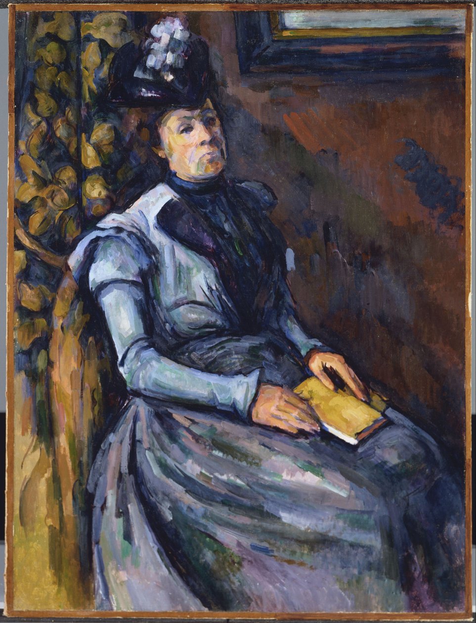 Siddende kvinde i blå af Paul Cézanne