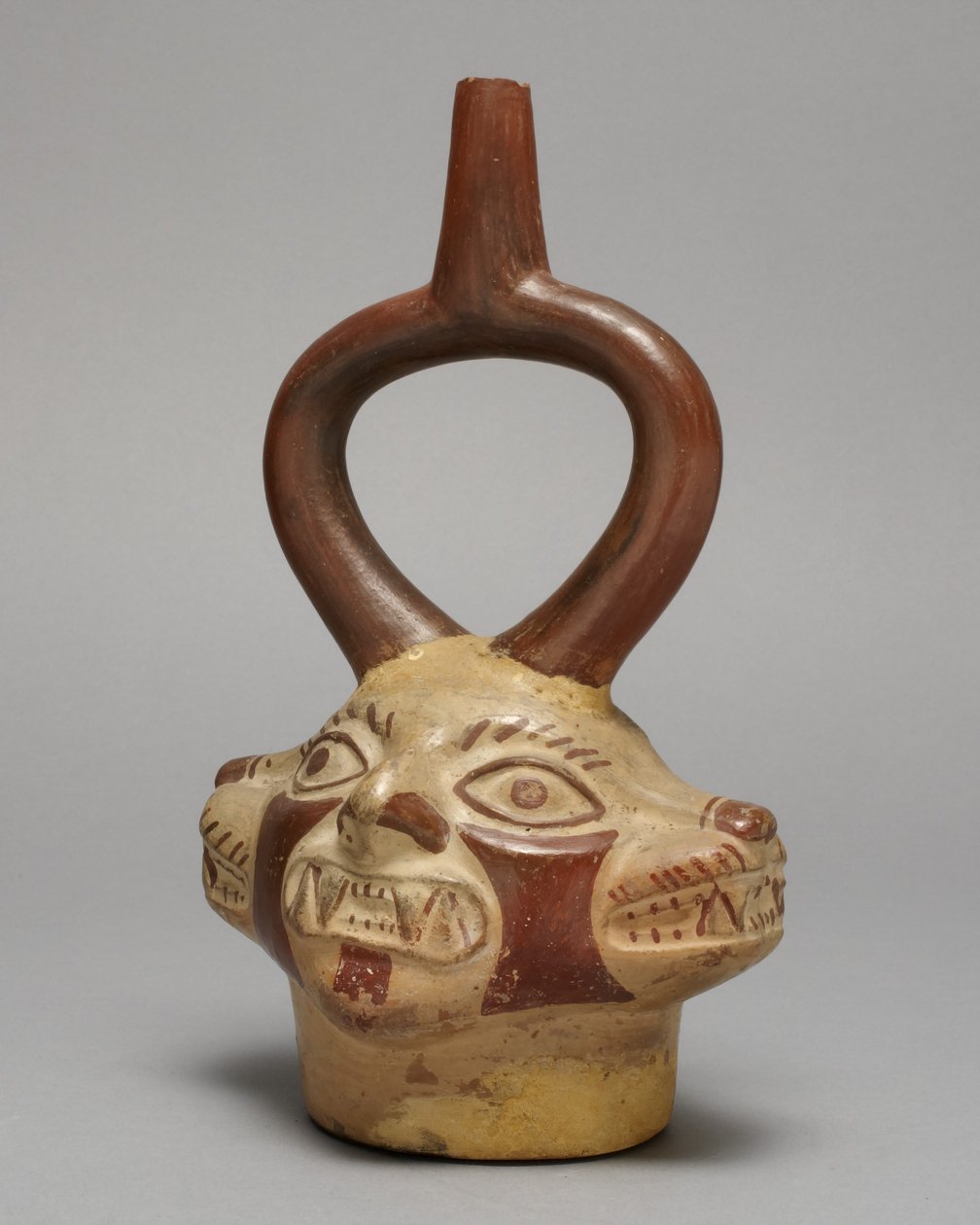 Stigbøjlekar i form af flerhovedet kattevæsen, A.D. 250-500 (keramik og pigment) af Peruvian School
