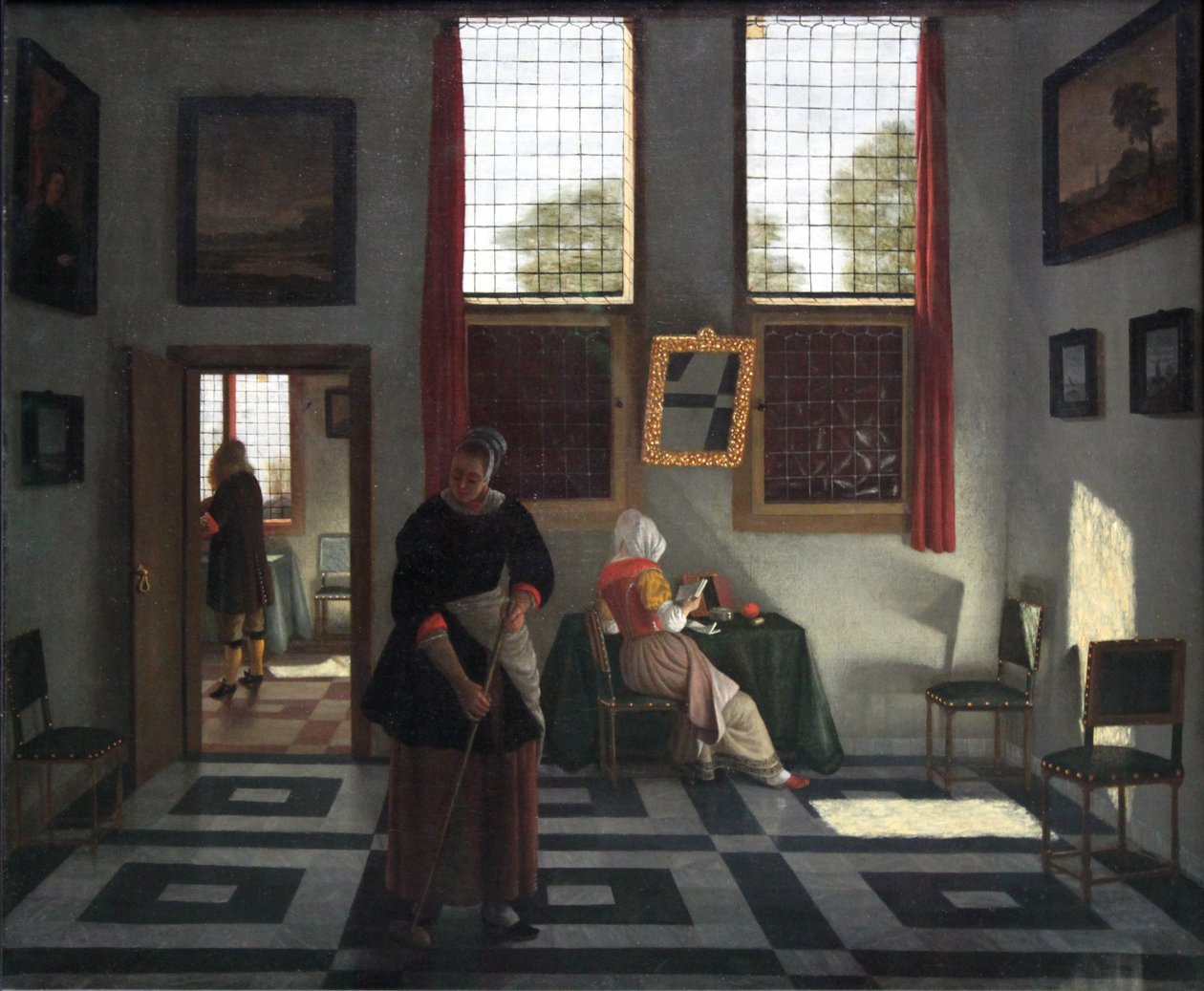Interiør med maler, læsende dame og fejende stuepige af Pieter Janssens