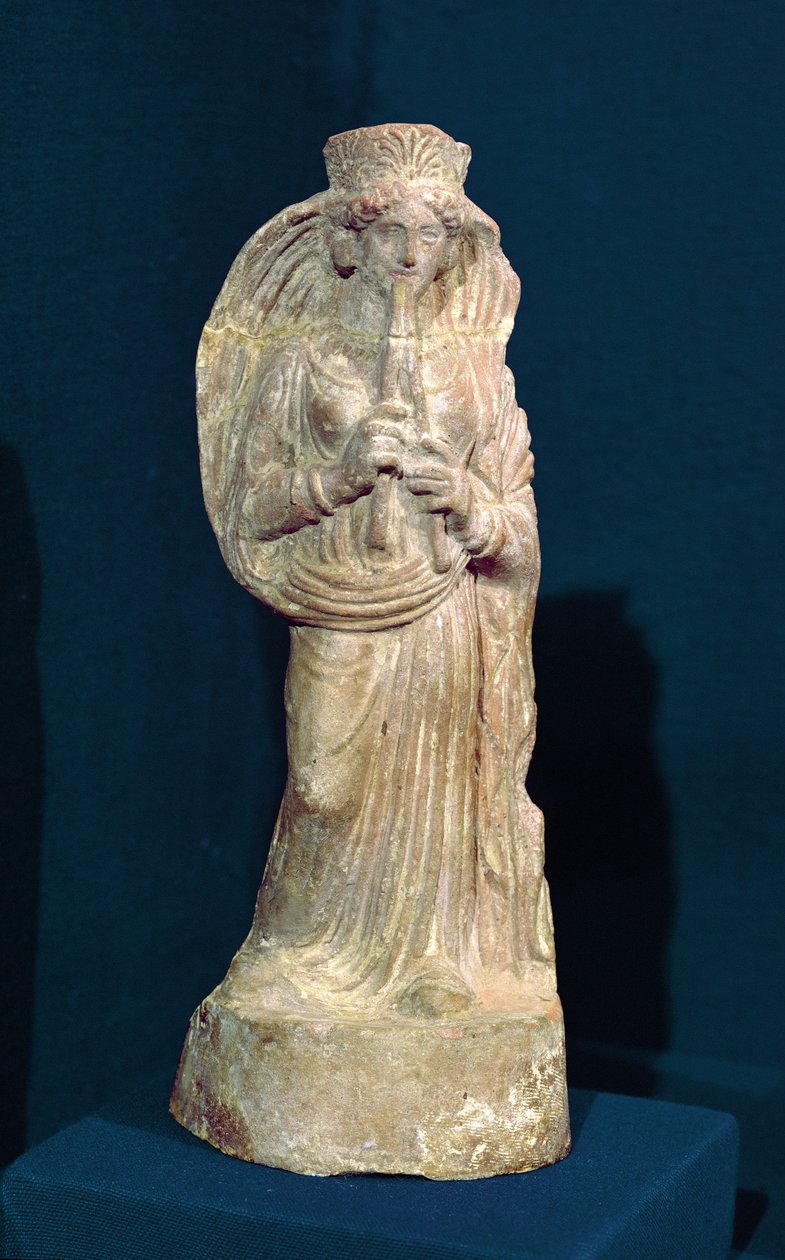 Statuette af en kvinde, der spiller en dobbeltfløjte, fra Tunesien (polykrom sten) af Punic