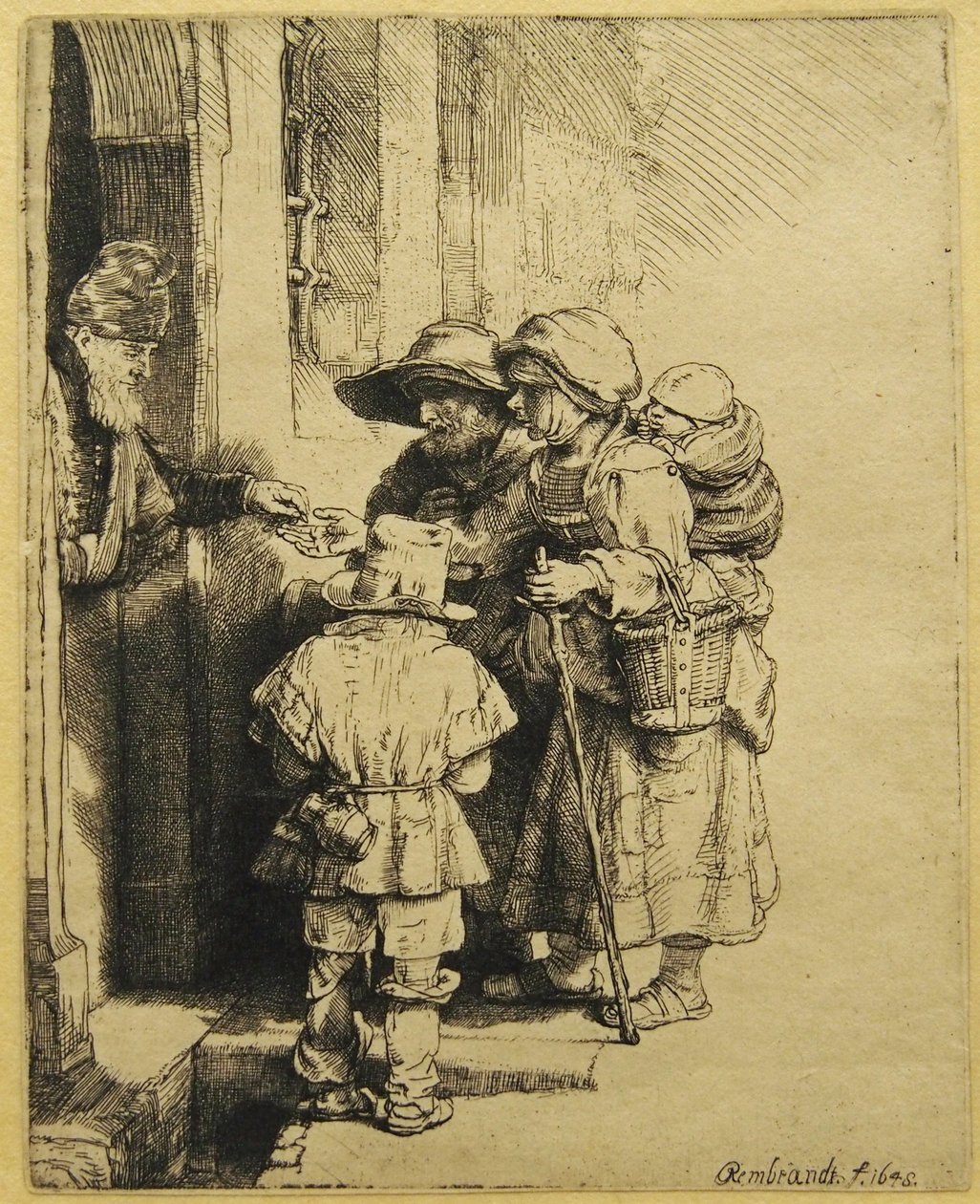 En blind, robust, robust spiller og familie, der modtager almisser af Rembrandt van Rijn