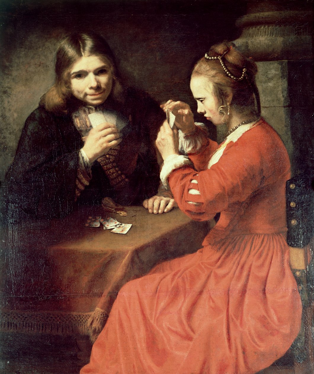 En ung mand og en pige spiller kort af Rembrandt van Rijn