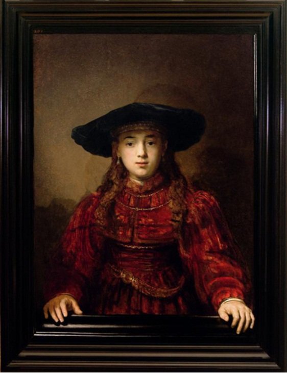 Pige i billedramme af Rembrandt van Rijn