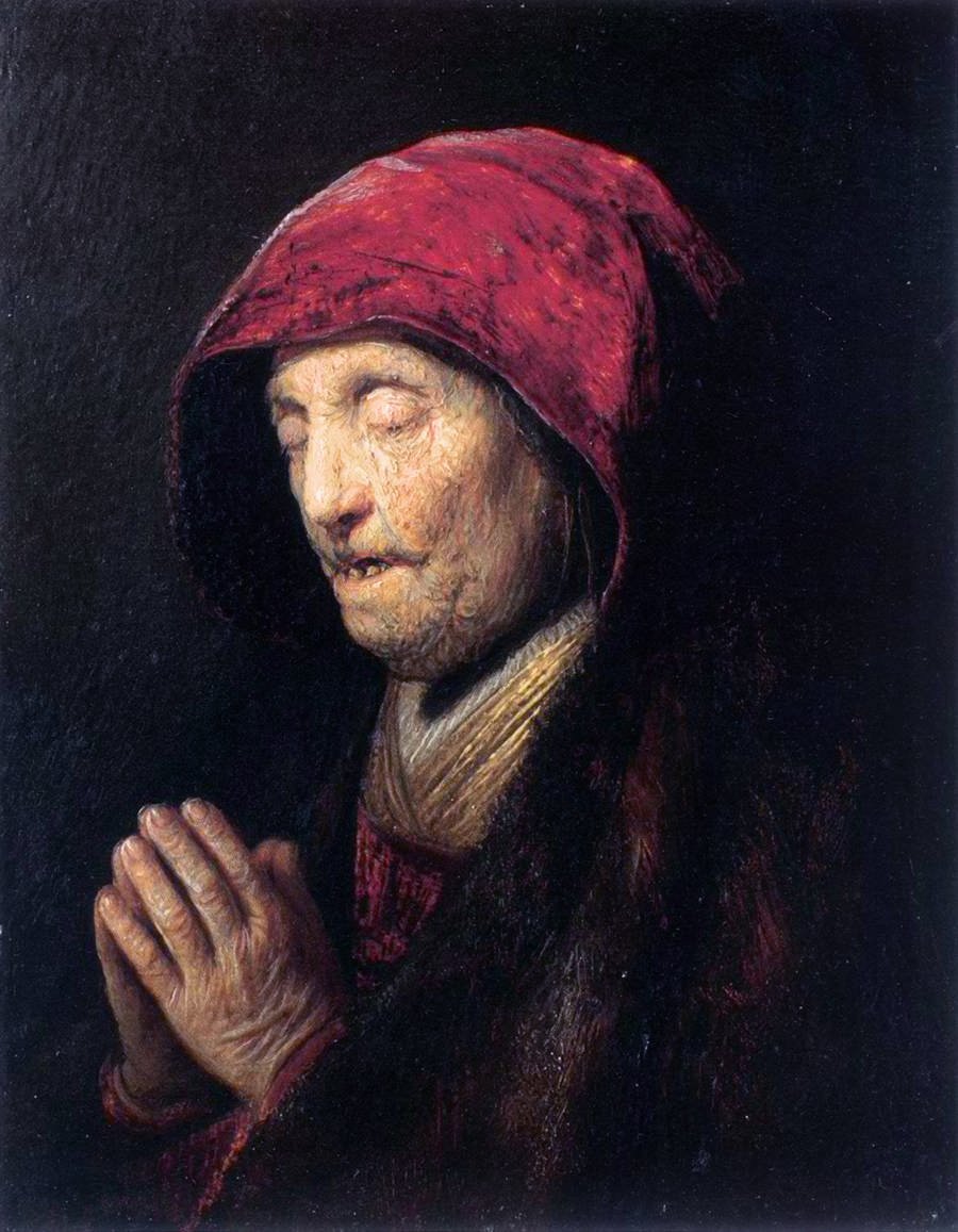 Gammel kvinde beder af Rembrandt van Rijn