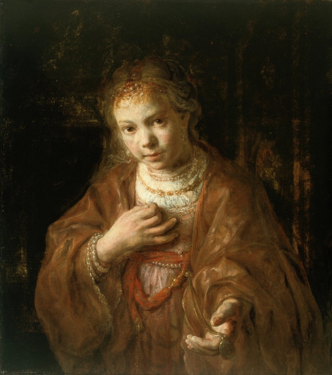 Ung pige holder en medalje af Rembrandt