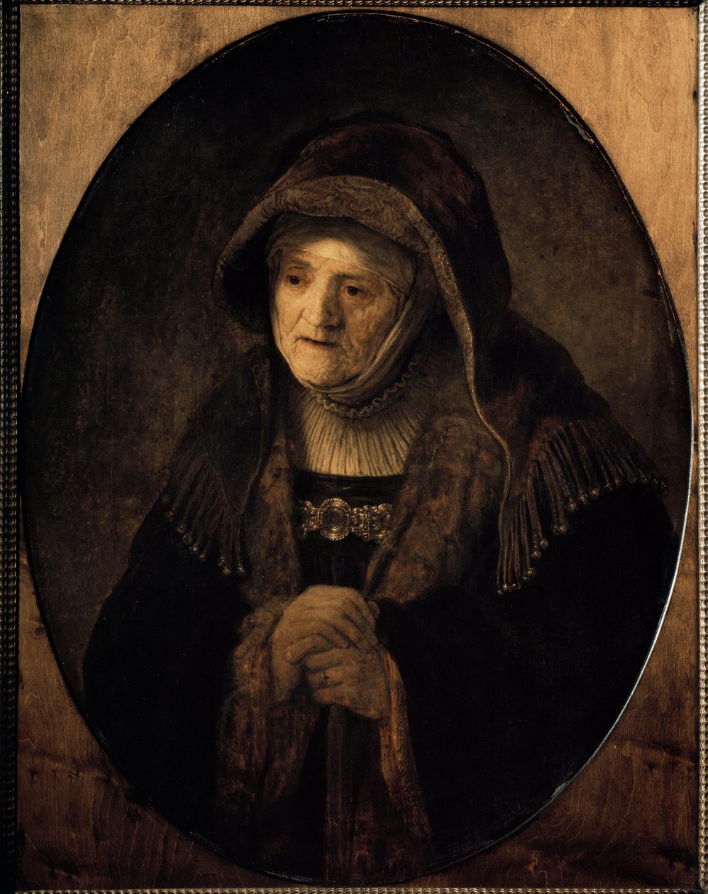 Portræt af kunstnerens mor lænende på sin stok (olie på lærred af Rembrandt van Rijn