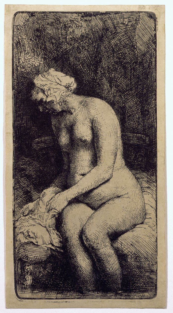 En kvinde bader sine fødder ved en bæk af Rembrandt van Rijn