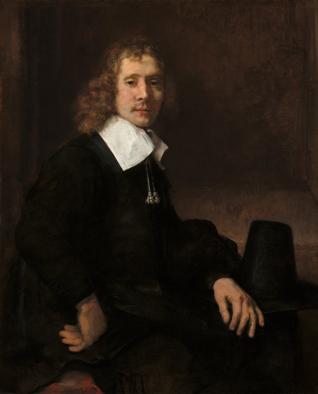 En ung mand ved et bord (muligvis Govaert Flinck) af Rembrandt van Rijn