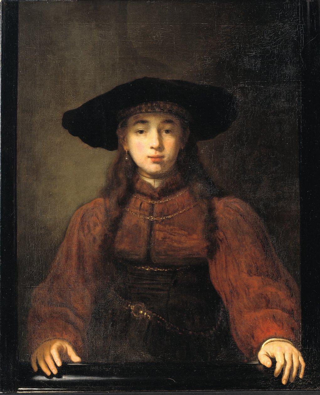 En ung kvinde hviler sine hænder på billedrammen af Rembrandt van Rijn