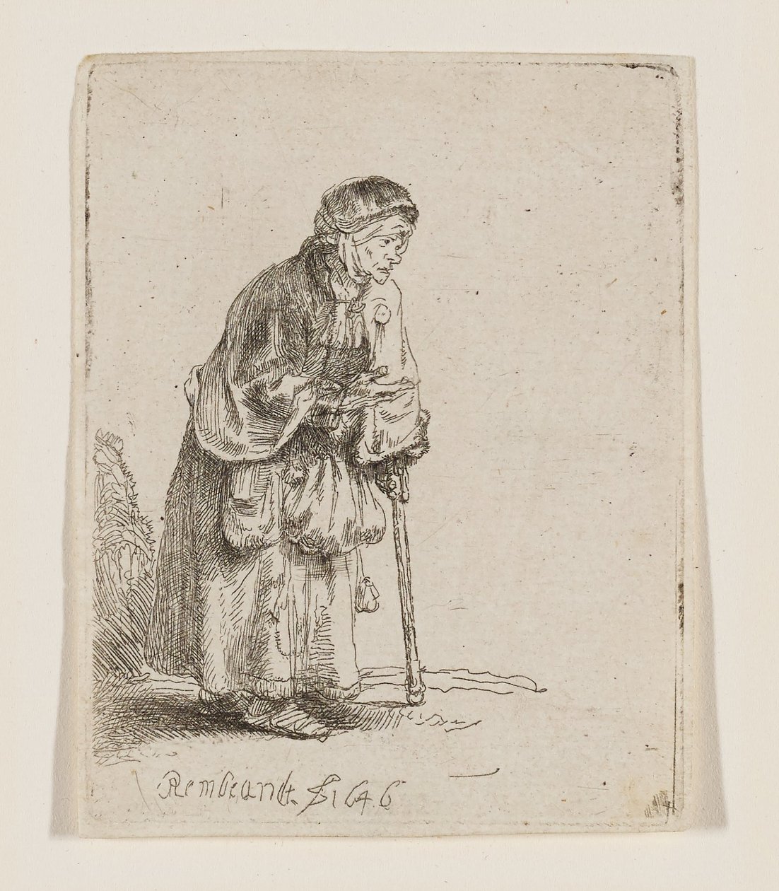 Tiggende kvinde støttet til en stok af Rembrandt van Rijn