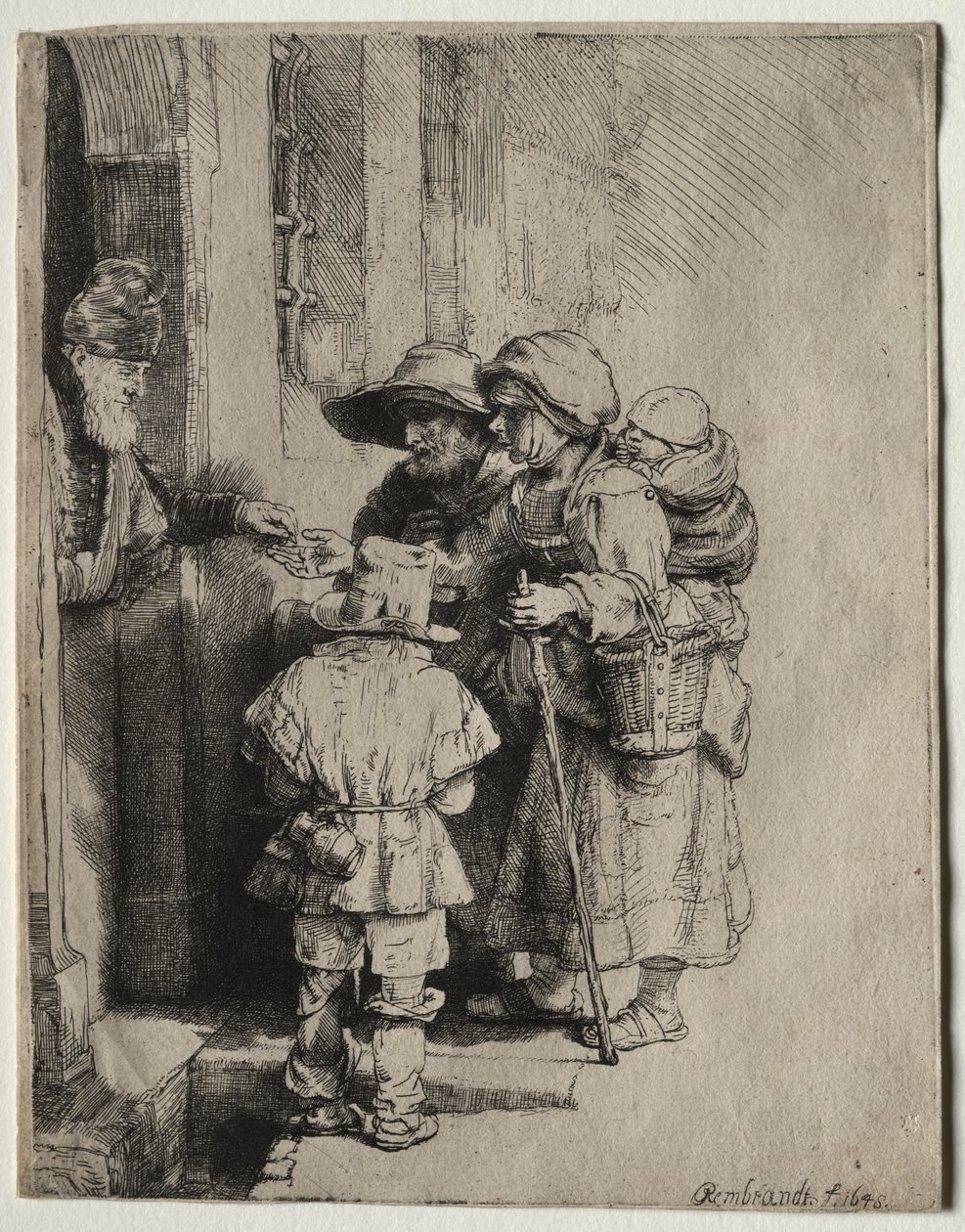 Tiggere, der modtager almisser ved døren til et hus af Rembrandt van Rijn