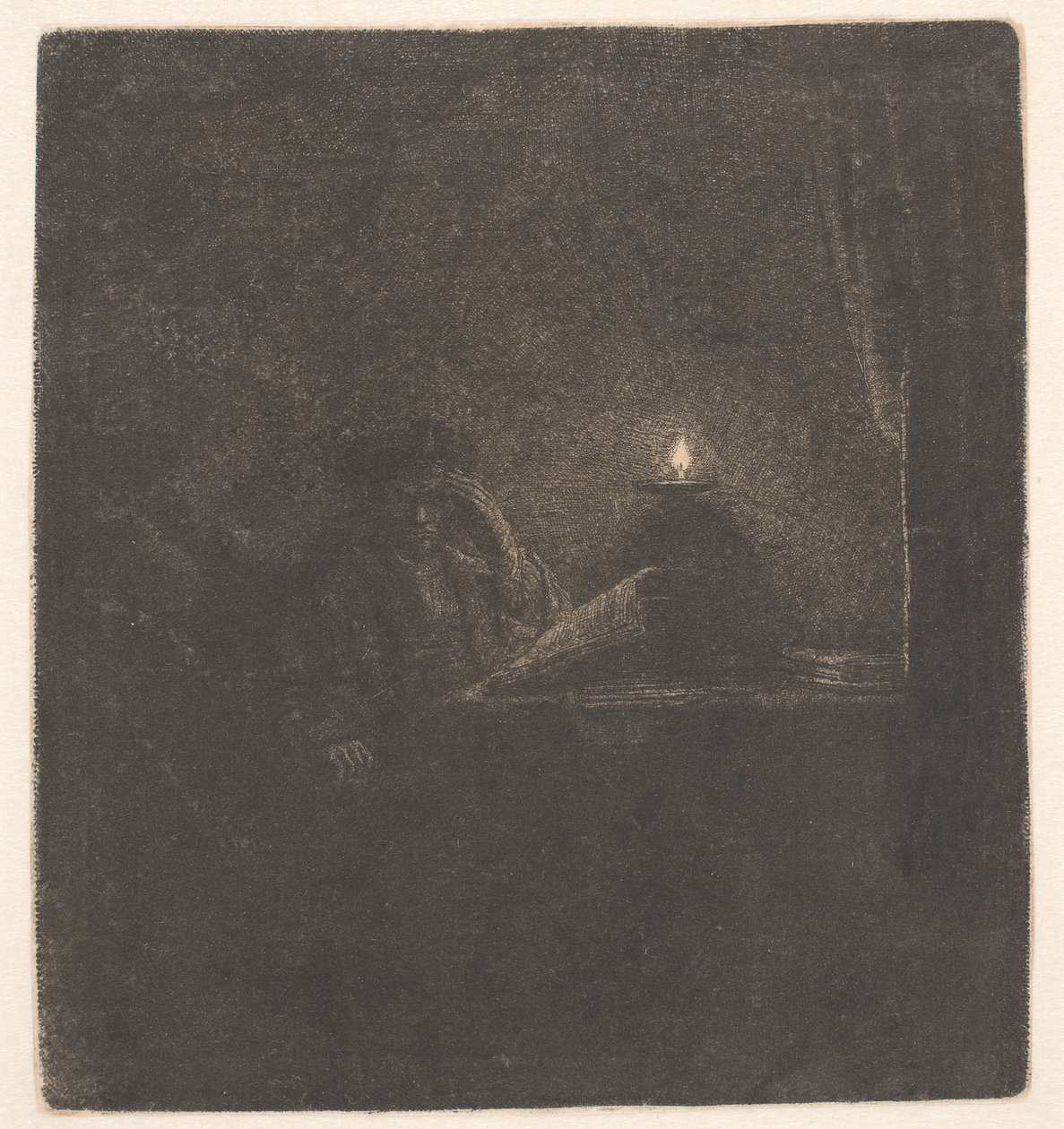 En studerende ved et bord i stearinlysets skær af Rembrandt van Rijn