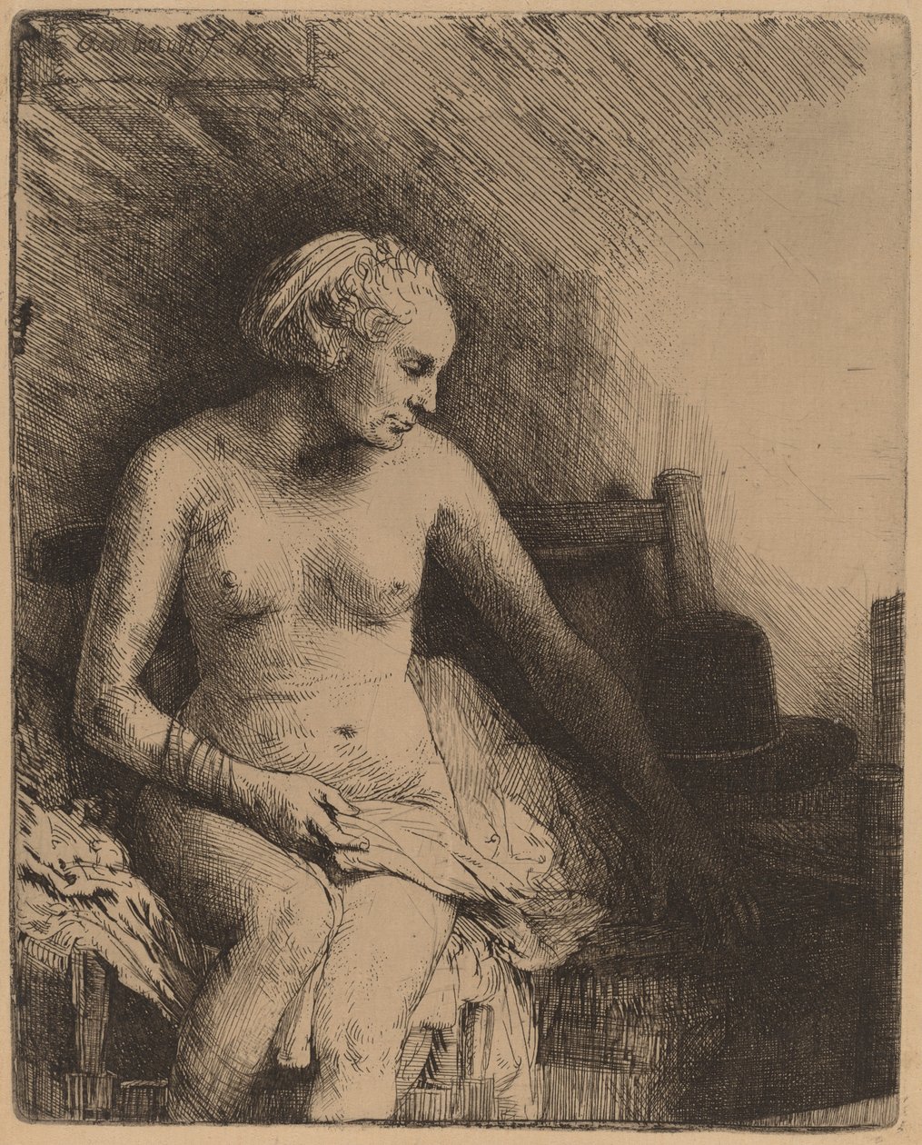Kvinde ved badet med en hat ved siden af hende af Rembrandt van Rijn