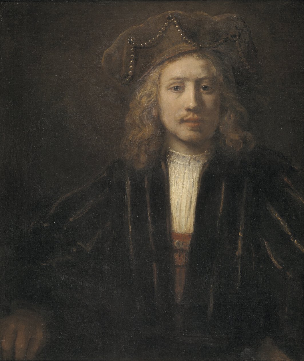 Ung mand i en perlebeklædt kasket af Rembrandt van Rijn
