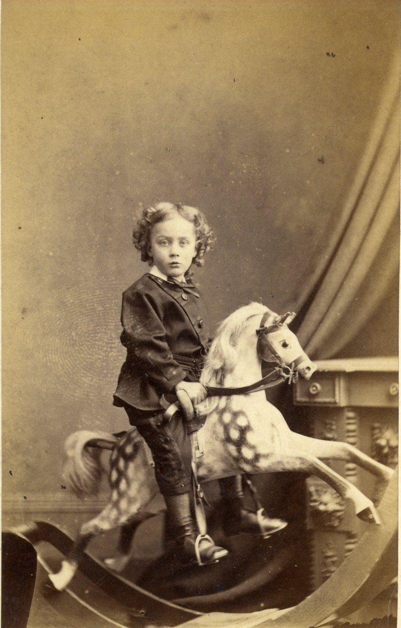 Ung dreng siddende på en gyngehest, 1860