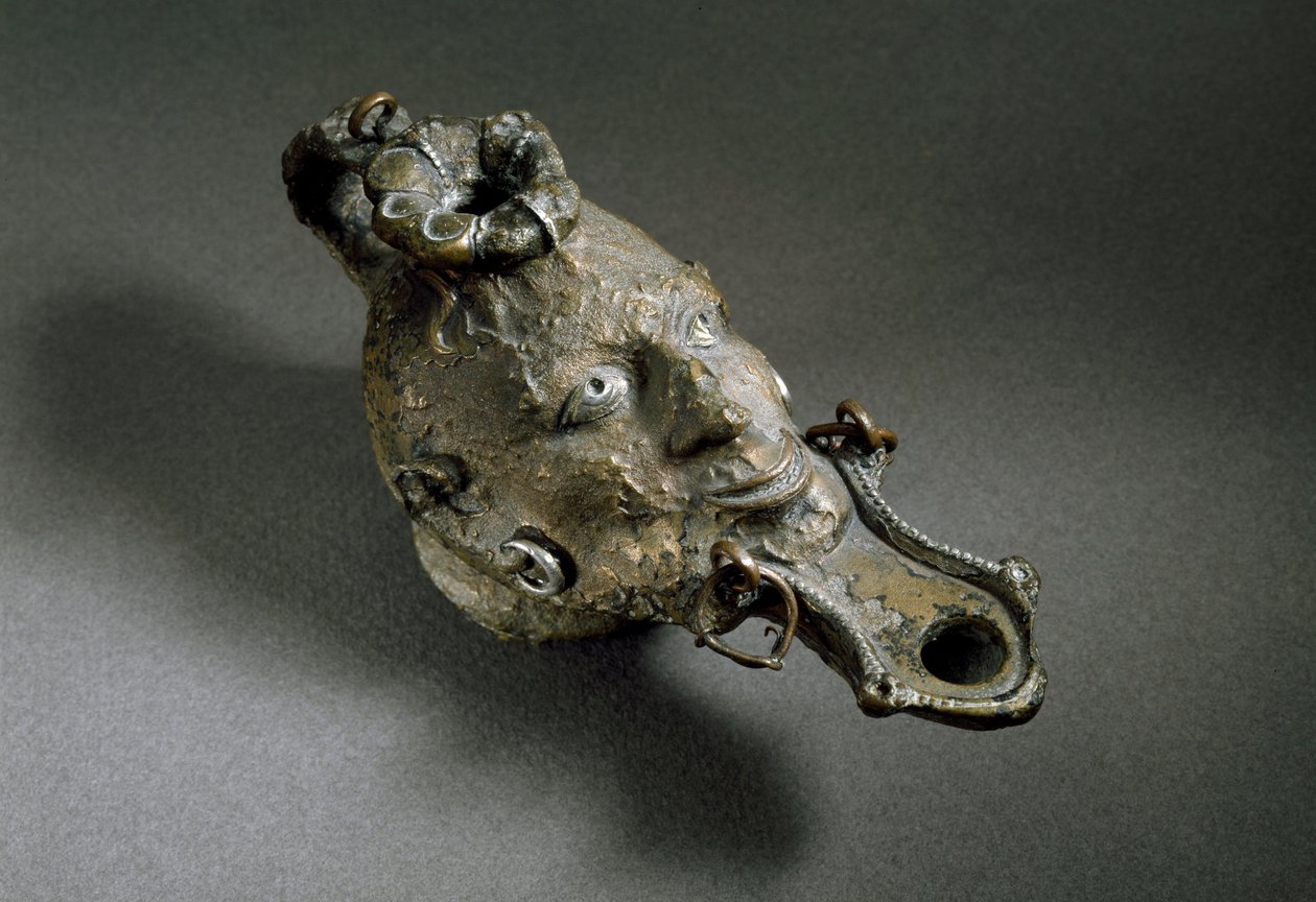 Romersk kunst: bronzeolielampe i form af et ansigt. 1. eller 2. århundrede e.Kr. Spaniens museum for Ampurias (Empurias) af Roman