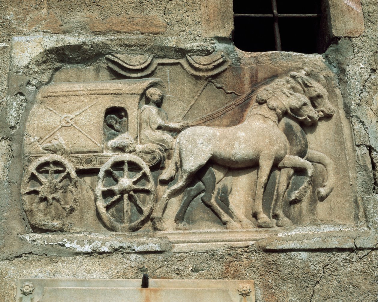 Vogn (til underverdenen?) fra en romersk grav, i dag på den sydlige mur af Maria Saal landsbykirke af Roman Roman