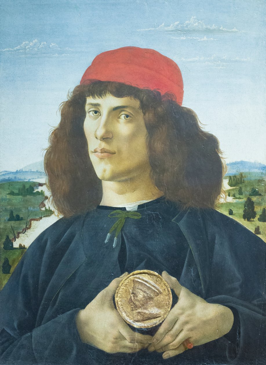Portræt af en ung mand, der holder en medaljon af Cosimo de
