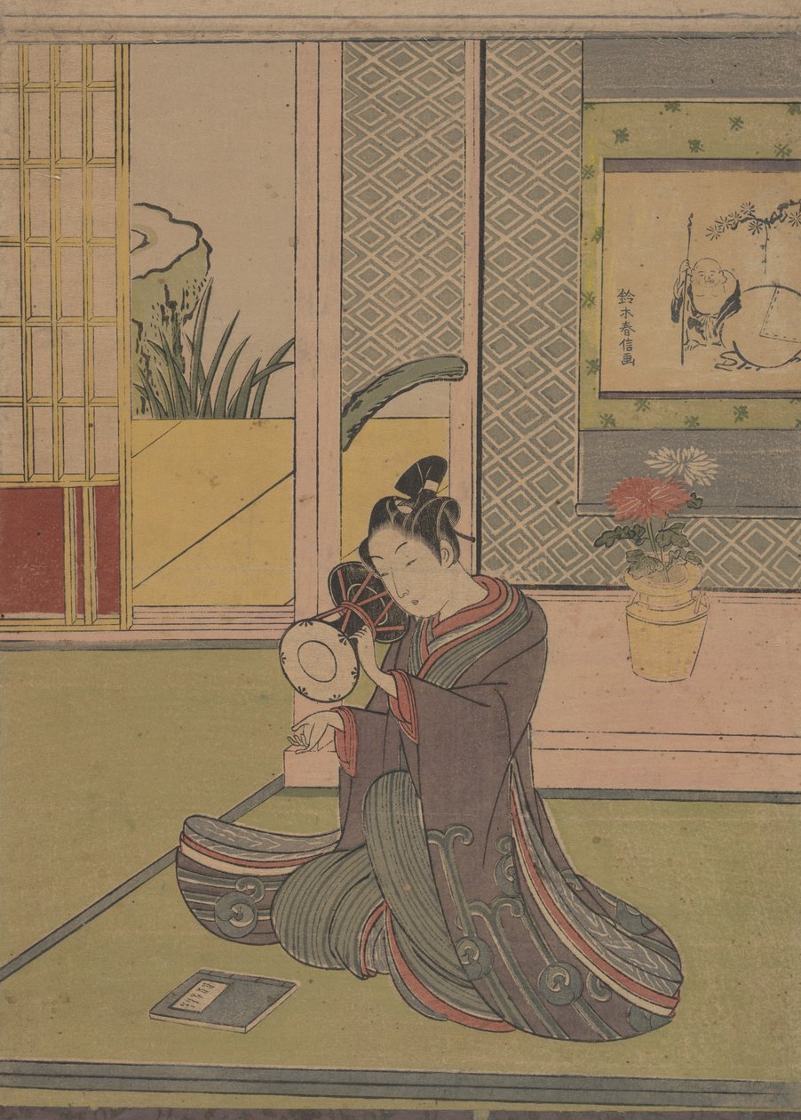 Ung mand spiller på en Noh-tromme. af Suzuki Harunobu