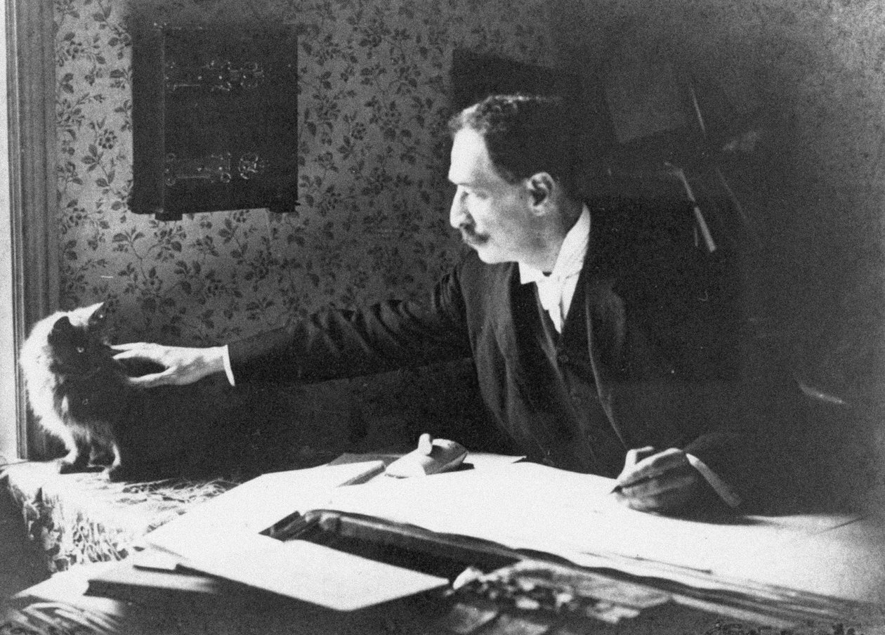 Louis Wain ved hans tegnebræt, 1890