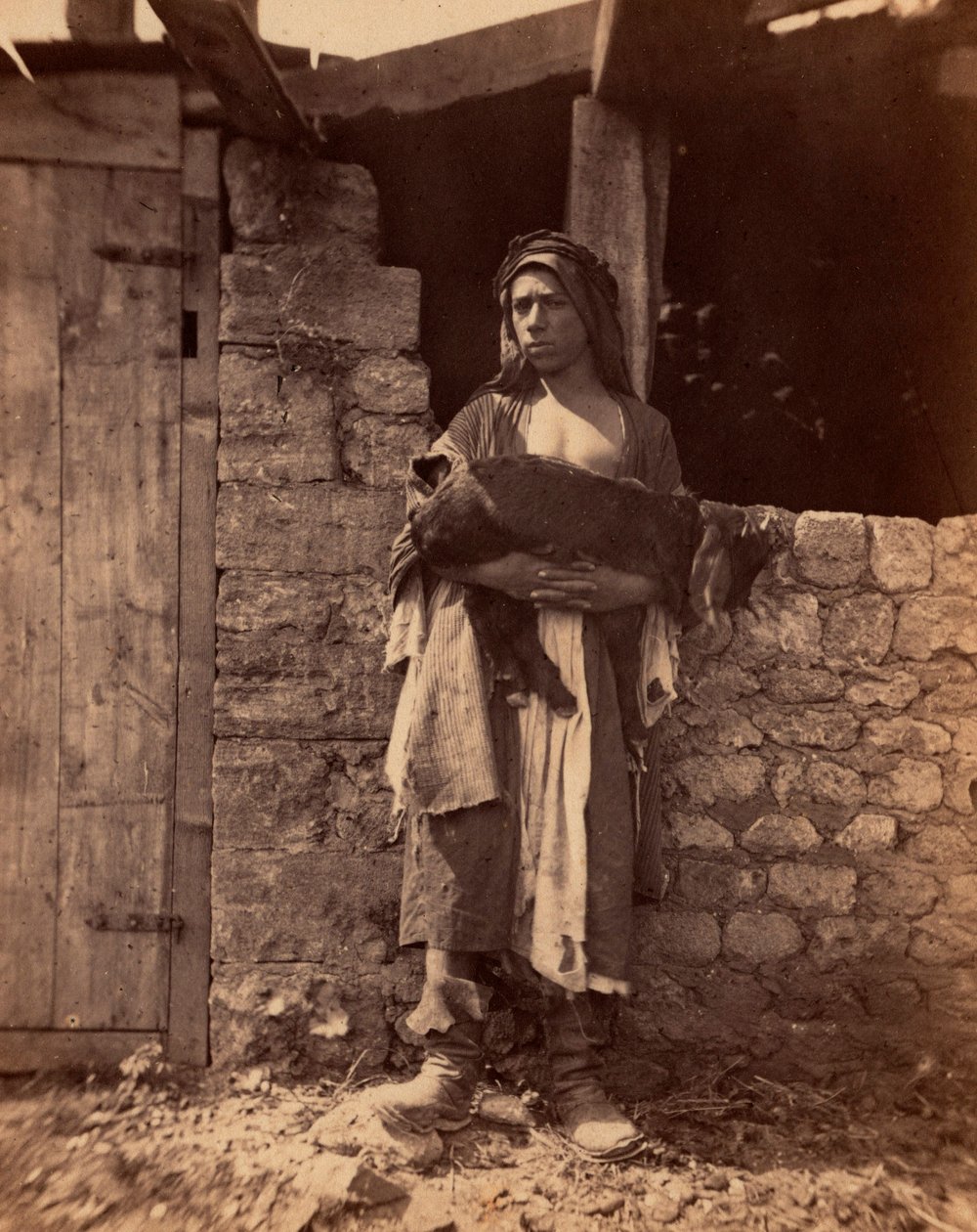 Libanons pater med et barn. Fotografi af Charles Lallemand (1826-1904) i "Syria, costumes, voyages and landscapes". 1865. Privat samling. af Unbekannter Künstler