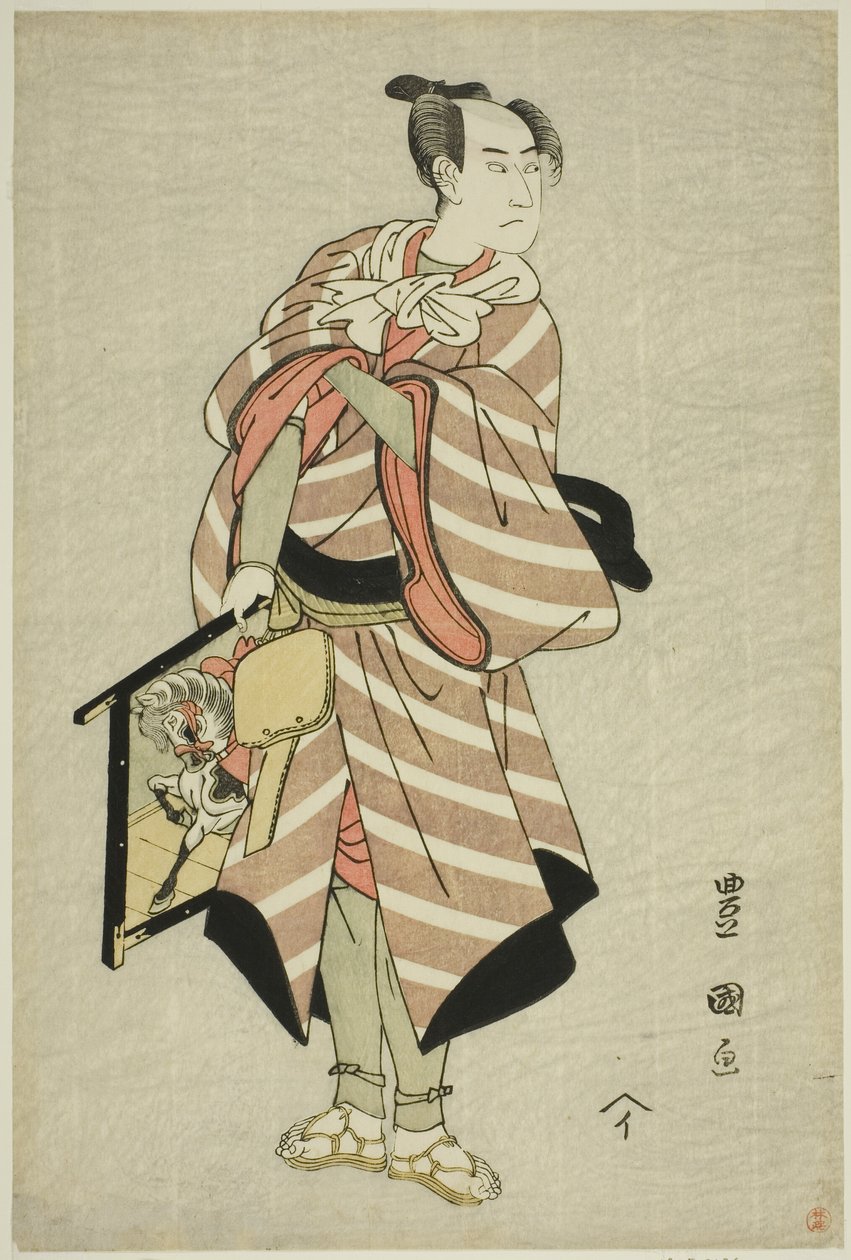 Skuespilleren Sawamura Sojuro III som pakkehest-manden Muchizo i stykket "Miyamairi Musubi no Kamigaki", opført på Kiri Theatre i den ellevte måned, 1797 af Utagawa Toyokuni I