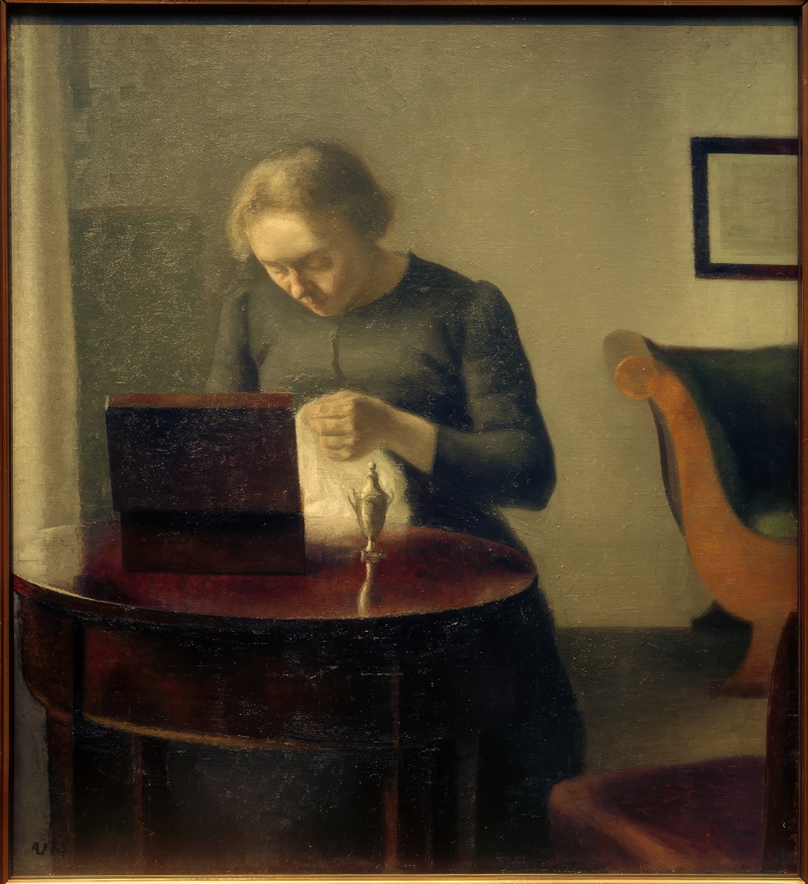 Kunstnerens kone ved sybordet af Vilhelm Hammershoi