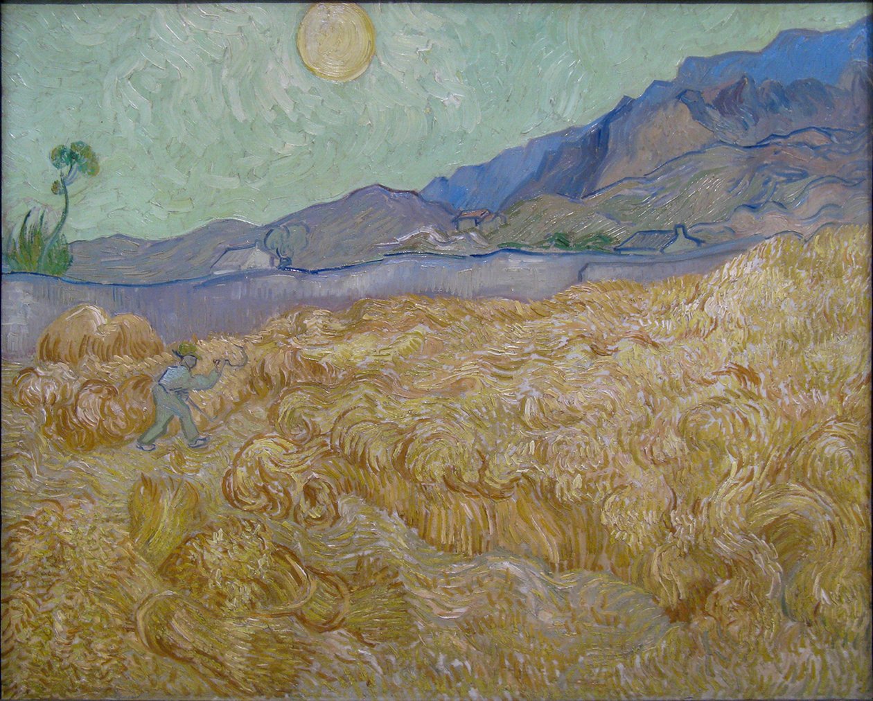 Hvedeplads med slåmaskine af Vincent van Gogh