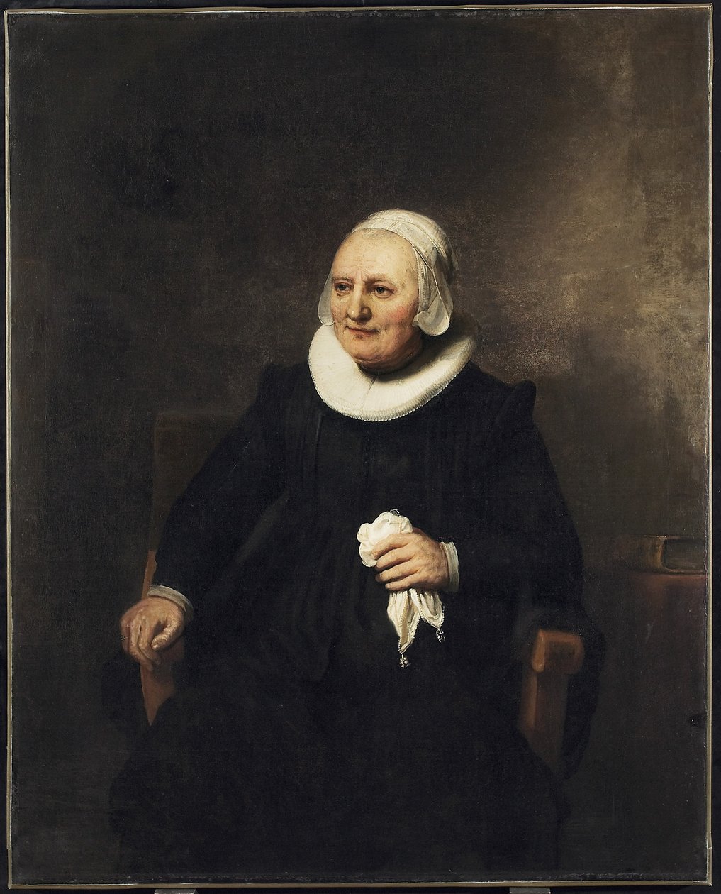 Portræt af en siddende kvinde med et lommetørklæde, 1644 af studio of Rembrandt Harmensz. van Rijn