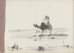 Mand rider på en kamel langs en kyst