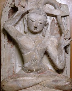 Siddende Buddha klipper sit hår