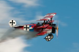 Historisk svæveflyvning med en rød trevinget flyver af Darek Siusta