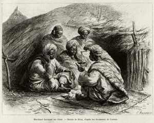 En købmand, der fascinerer en kunde, sidder på gulvet, på en lille måtte, han laver artiklen ved at holde en vægt. Gravering af Riou, for at illustrere historien ""Fra Niger til Guineabugten"", af kaptajn Louis Gustave Binger (1856-1936), i 1887-1889, i af Edouard Riou