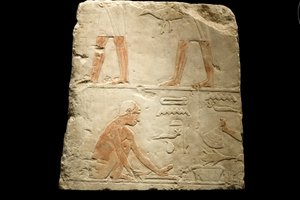 Fragment af et relief, der forestiller madlavning (kalksten)