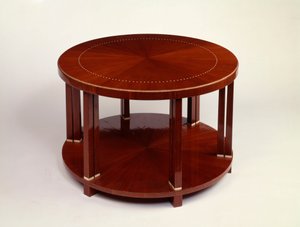 Et lavt rundt dobbeltplansbord med palisanderfiner, indlagt med elfenben (palisander, elfenben) af Émile Jacques Ruhlmann