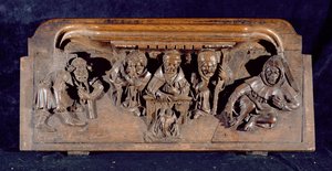 En misericord, der skildrer en akademiker, der sidder ved et panelbord og leverer en formaning til en knælende angrende, New College Chapel, Oxford, slutningen af det 14. århundrede (træ)