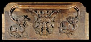 En misericord, der skildrer tre menneskeansigter flankeret af monstre, New College Chapel, Oxford, slutningen af det 14. århundrede (træ)