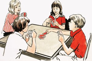 Vier Kinder spielen Karten