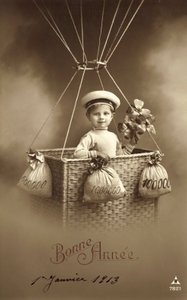 1913 nytårskort, med dreng bestig en ballon, med en masse penge som ballast af French Photographer