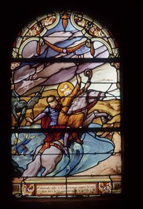 St. Guenolé, abbed af Landévennec, redder kong Gralon under oversvømmelsen af byen Ys - farvede ruder i St. Germain-kirken i Kerlaz af French School