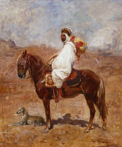 En araber på en hest i et ørkenlandskab