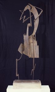 Kvinde arrangerer sit hår, 1929-30 (metal)