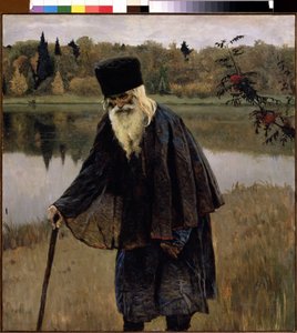 En Eremit (En Eremit). En gammel mand, med skæg og hvidt hår, går, bøjet over sin stok, på bredden af ​​en sø. Maleri af Mikhail Vasilyevich Nesterov (1862-1942), olie på lærred