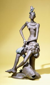 An African Dancer Seated with a Large Fish at her Feet, a Karlsruhe terracotta figuredani