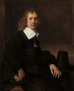 En ung mand ved et bord (muligvis Govaert Flinck) af Rembrandt van Rijn
