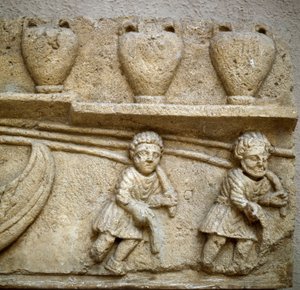 Romersk kunst: slæbning af en båd lastet med tønder bestemt til handel. Detalje. Relief fra Cabrieres d