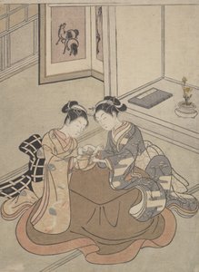 To unge kvinder siddende ved en Kotatsu-spillende kattevugge, ca. 1765., ca. 1765. af Suzuki Harunobu