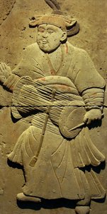 Terracotta stele med musiker, Tang-dynastiet (618-907), opdaget i Shaanxi-provinsen, Steles Forest Museum i Xian. Fotografi, Leonard de Selva, Kina, 2006. af Tang Dynasty Chinese School