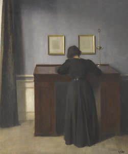 Ida står ved et skrivebord af Vilhelm Hammershøi